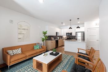 White upper cabinets with light wood lower cabinets & charcoal ceramic backsplash